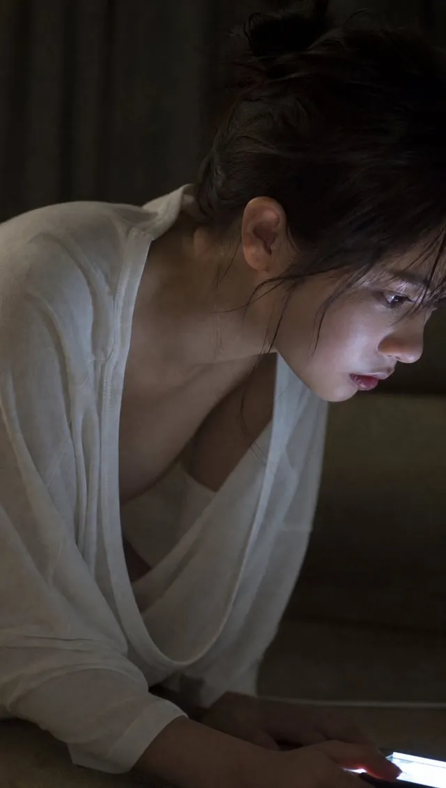 Moody Woman Looking at Phone